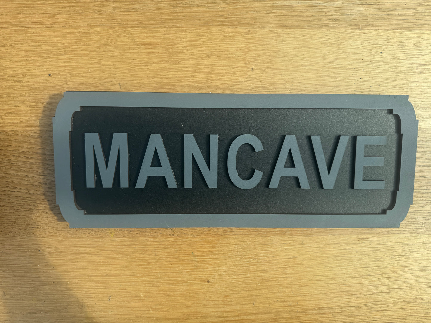 Mancave street sign